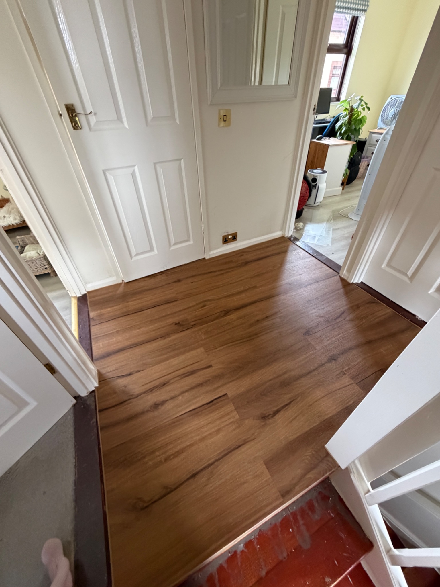Finished wood-effect flooring in a hallway